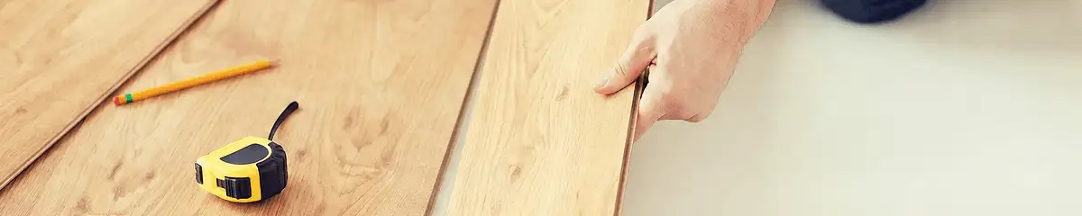 A professional installing wood flooring in Stockton, CA