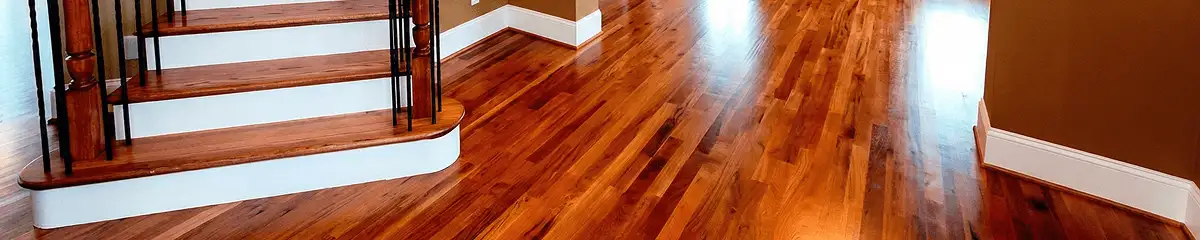Base floor of a staircase with professionally restored wood flooring in Stockton CA