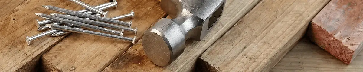 Hammer and nails on hardwood flooring boards in Stockton, CA