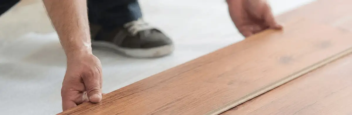 A professional installing laminate flooring in Stockton, CA