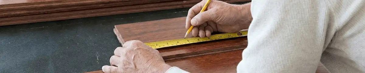 A professional installing wood flooring in Stockton, CA